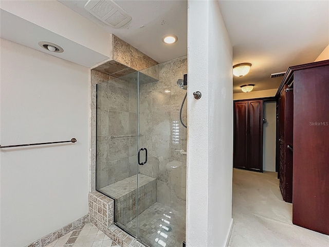 bathroom featuring visible vents and a stall shower