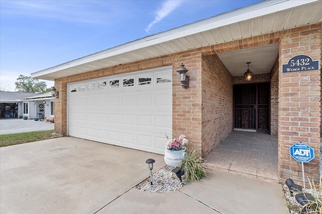 garage with concrete driveway