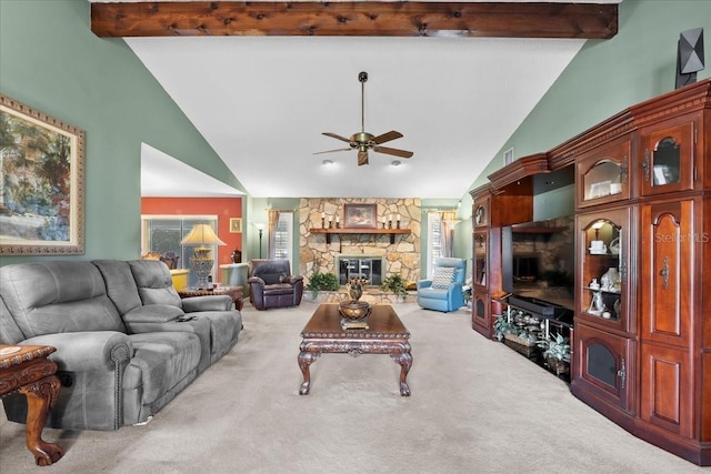living room with beamed ceiling, carpet floors, ceiling fan, and a fireplace