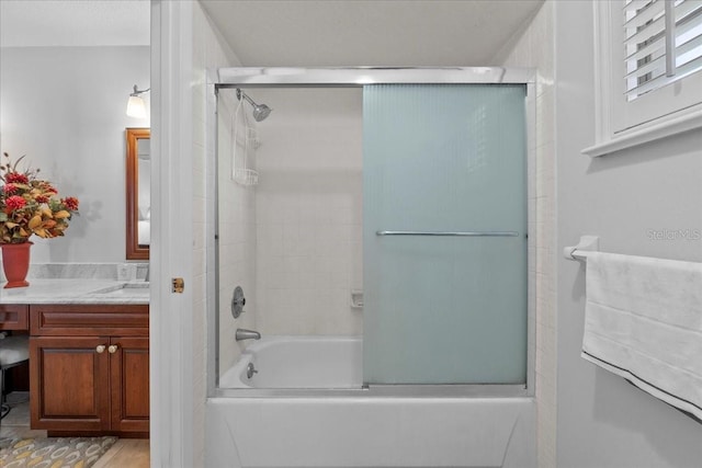 full bath featuring enclosed tub / shower combo and vanity