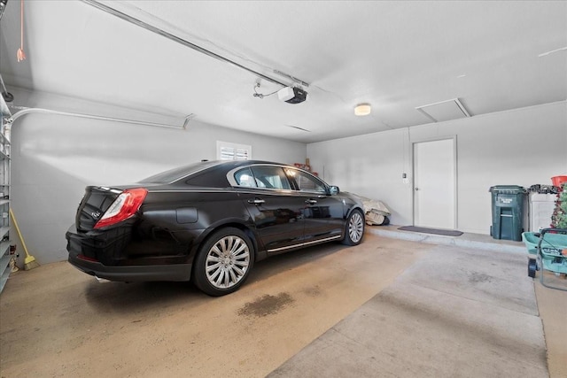 garage featuring a garage door opener