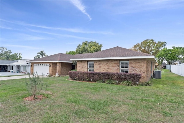 single story home featuring brick siding, fence, a front yard, central AC unit, and an attached garage