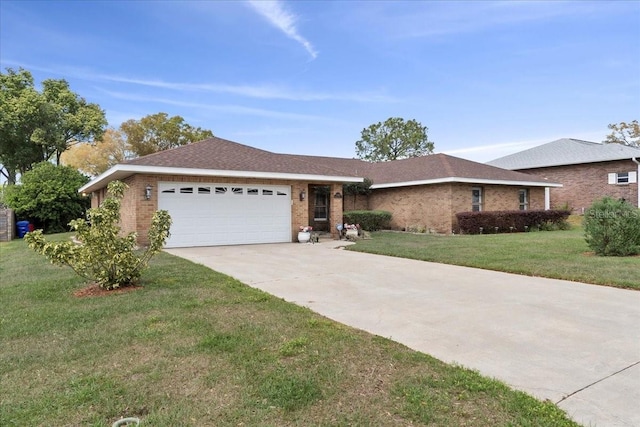ranch-style house with concrete driveway, brick siding, a garage, and a front lawn