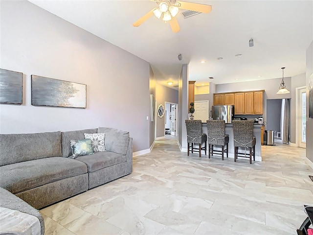 2420 Windchaser Ct, Melbourne, FL 32904 - living room with visible vents, baseboards, and a ceiling fan