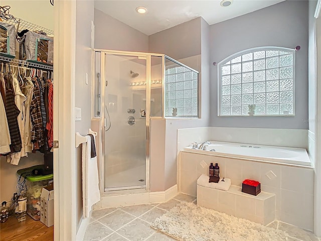 2420 Windchaser Ct, Melbourne, FL 32904 - bathroom featuring a shower stall, a bath, and a walk in closet