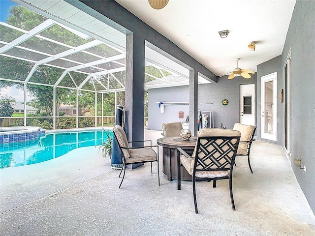 2420 Windchaser Ct, Melbourne, FL 32904 - view of swimming pool featuring ceiling fan, glass enclosure, a patio, an in ground hot tub, and a fenced in pool