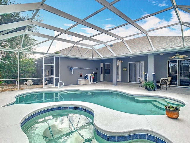 2420 Windchaser Ct, Melbourne, FL 32904 - pool featuring a patio area, an in ground hot tub, glass enclosure, and ceiling fan