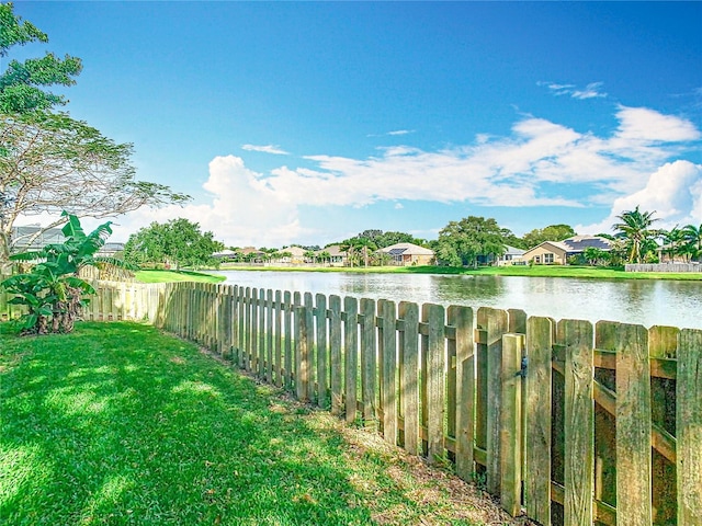2420 Windchaser Ct, Melbourne, FL 32904 - view of yard featuring a fenced backyard and a water view