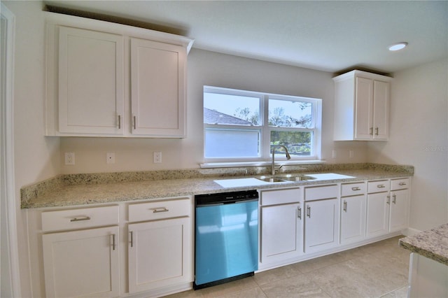 kitchen featuring light tile patterned flooring, white cabinets, dishwasher, light stone countertops, and a sink