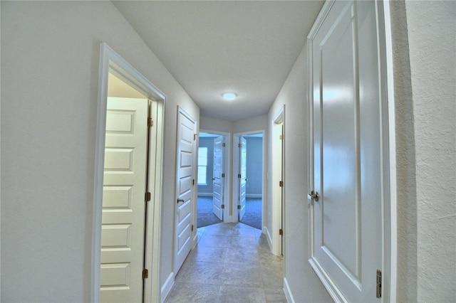 corridor featuring baseboards