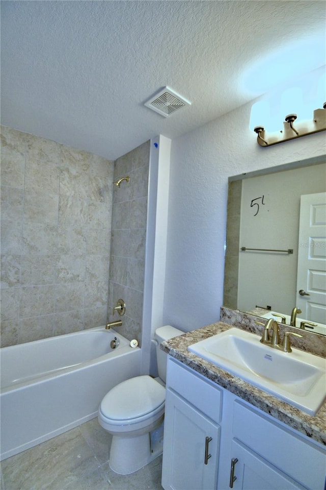 full bathroom featuring toilet, vanity, shower / bathtub combination, a textured ceiling, and visible vents