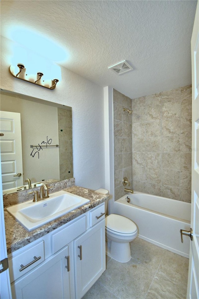 bathroom with toilet, vanity, bathing tub / shower combination, a textured ceiling, and visible vents