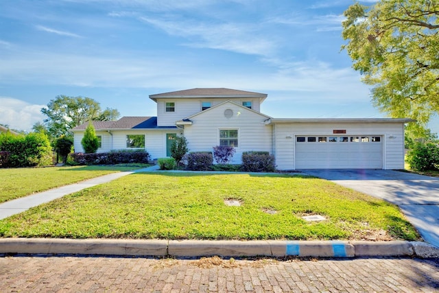 2816 Fairmount Ave, Lakeland, FL 33803 - traditional-style home featuring concrete driveway, a garage, and a front yard