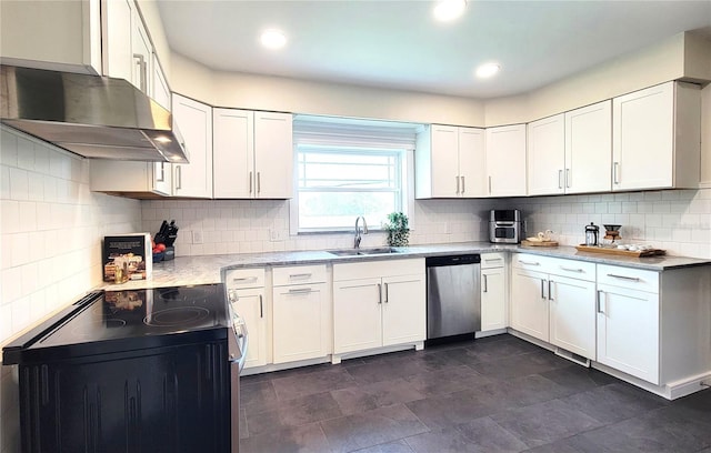 2816 Fairmount Ave, Lakeland, FL 33803 - kitchen with stainless steel dishwasher, electric range, ventilation hood, and white cabinetry