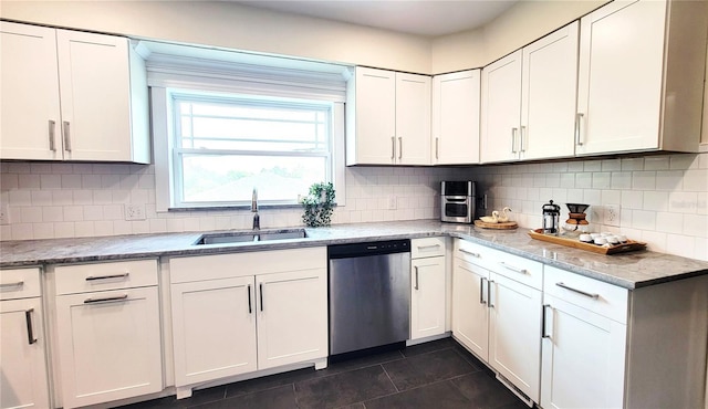 2816 Fairmount Ave, Lakeland, FL 33803 - kitchen featuring dishwasher, white cabinets, and backsplash