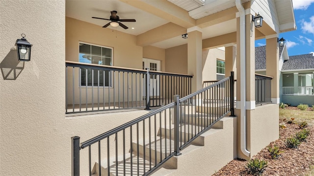 exterior space with stairway and a ceiling fan