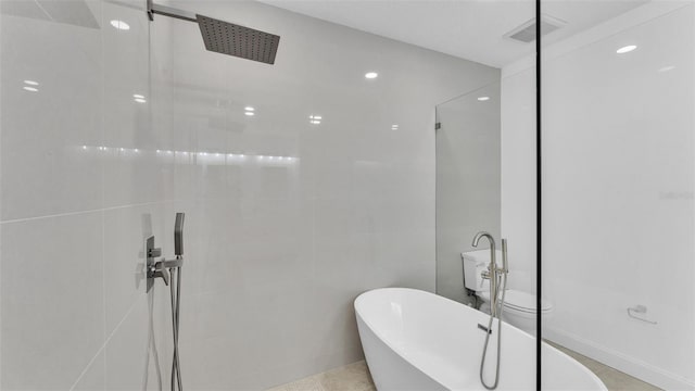 full bathroom with walk in shower, a freestanding bath, visible vents, and recessed lighting