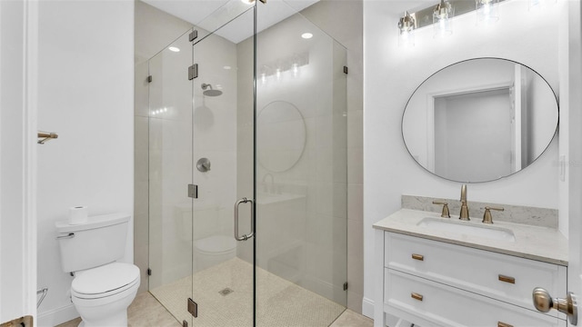 full bath featuring toilet, vanity, and a stall shower