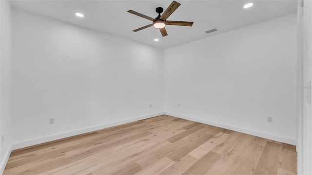 unfurnished room with light wood-type flooring, visible vents, a ceiling fan, and recessed lighting