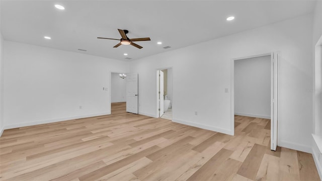 unfurnished bedroom featuring light wood-style flooring, recessed lighting, baseboards, visible vents, and connected bathroom