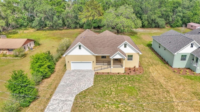 birds eye view of property with a wooded view