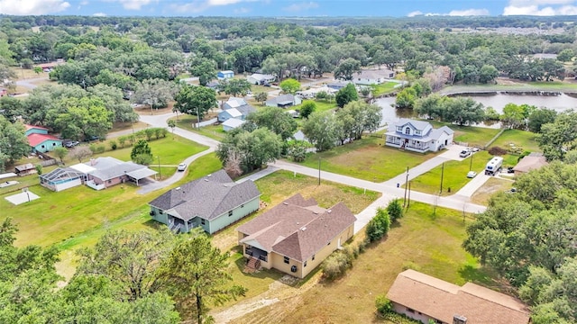 birds eye view of property featuring a water view and a residential view