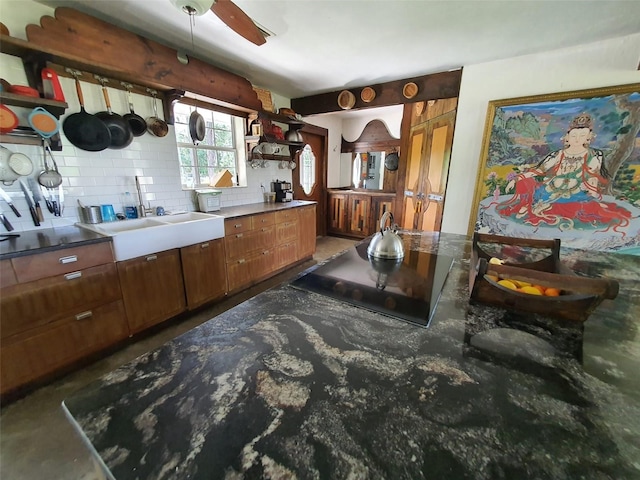 8922 Pritcher Rd, Lithia, FL 33547 - kitchen with open shelves, decorative backsplash, a ceiling fan, brown cabinets, and black electric stovetop