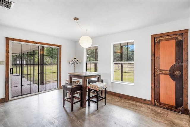 8922 Pritcher Rd, Lithia, FL 33547 - dining space with finished concrete floors and baseboards