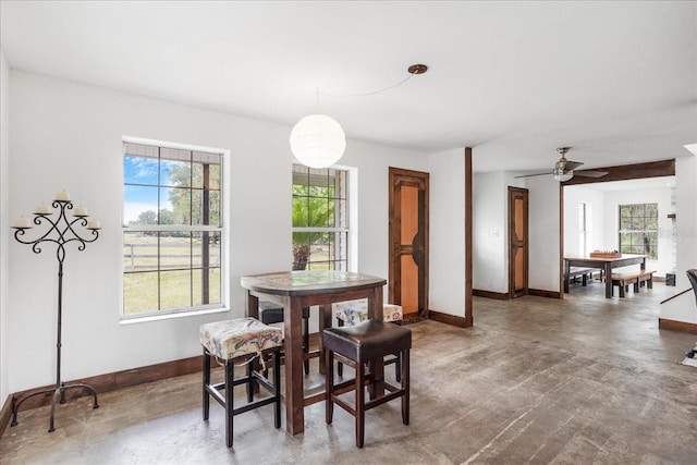 8922 Pritcher Rd, Lithia, FL 33547 - dining area featuring baseboards, concrete flooring, and ceiling fan