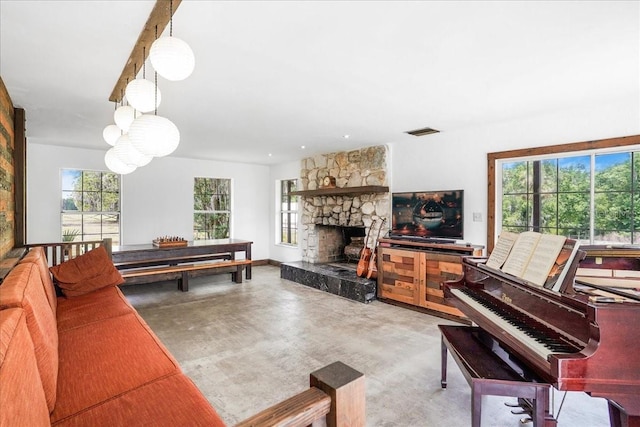 8922 Pritcher Rd, Lithia, FL 33547 - living room with finished concrete floors and a fireplace