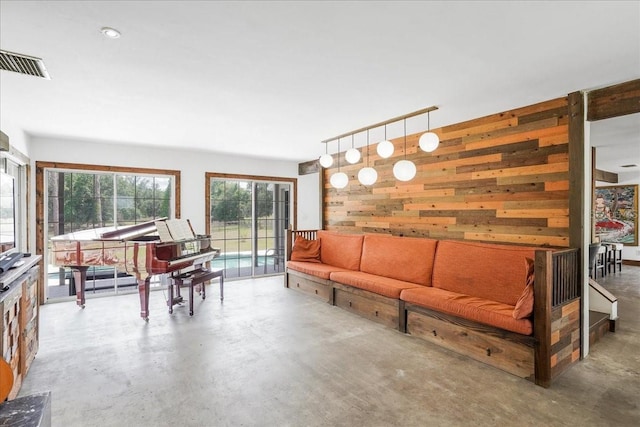 8922 Pritcher Rd, Lithia, FL 33547 - living area featuring concrete floors and wood walls