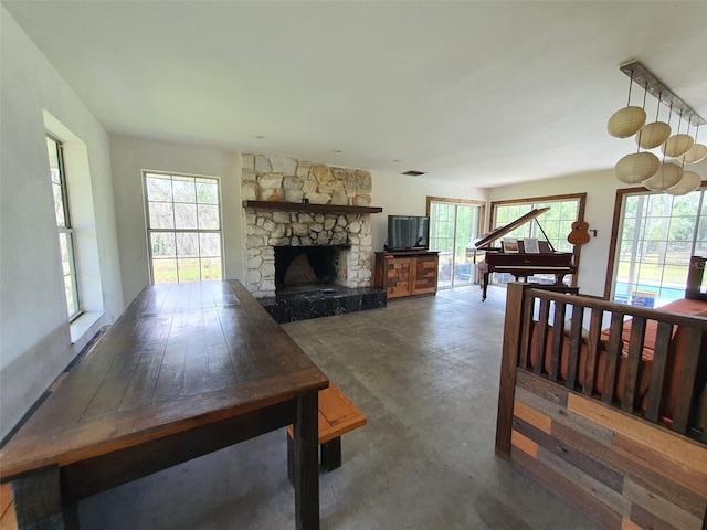 8922 Pritcher Rd, Lithia, FL 33547 - living room featuring concrete flooring and a fireplace