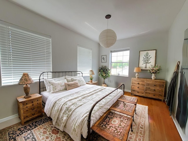 8922 Pritcher Rd, Lithia, FL 33547 - bedroom with light wood finished floors and baseboards