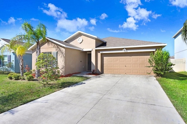ranch-style house featuring stucco siding, driveway, an attached garage, and a front yard