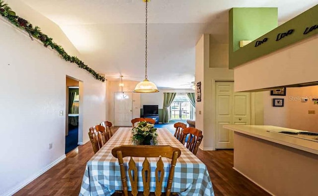 720 Cedar Knoll Dr N, Lakeland, FL 33809 - dining room with baseboards, dark wood-style flooring, and vaulted ceiling