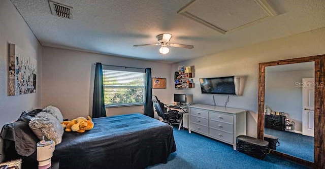 720 Cedar Knoll Dr N, Lakeland, FL 33809 - carpeted bedroom featuring a textured ceiling, visible vents, ceiling fan, and attic access