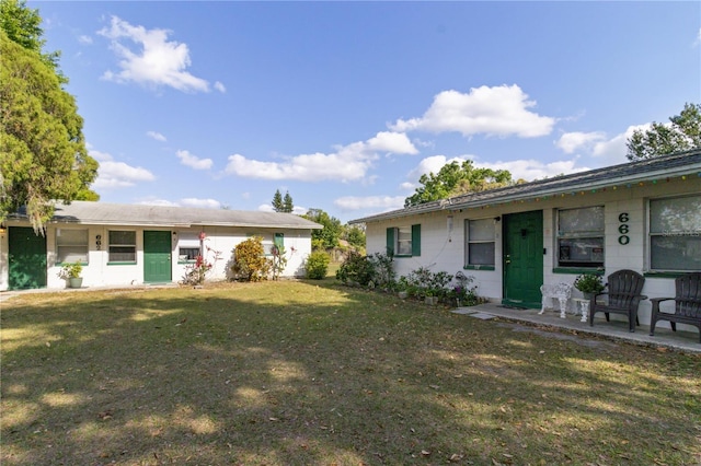 658, 660, 662 24th St NW, Winter Haven, FL 33880 - exterior space with a front lawn and concrete block siding