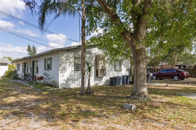 658, 660, 662 24th St NW, Winter Haven, FL 33880 - view of side of home featuring concrete block siding