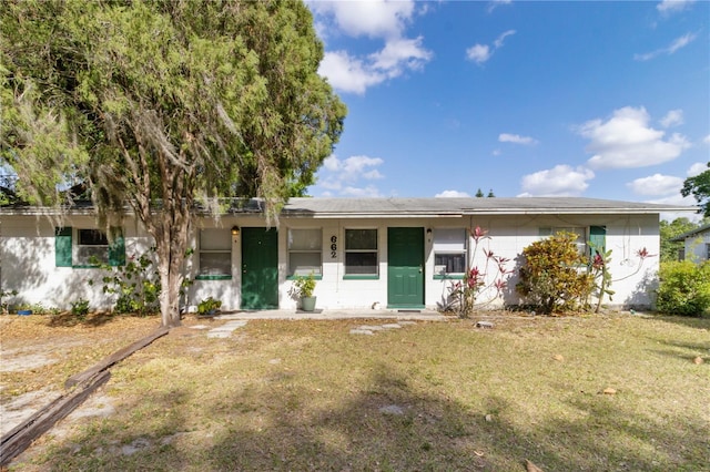 658, 660, 662 24th St NW, Winter Haven, FL 33880 - ranch-style home featuring a front lawn