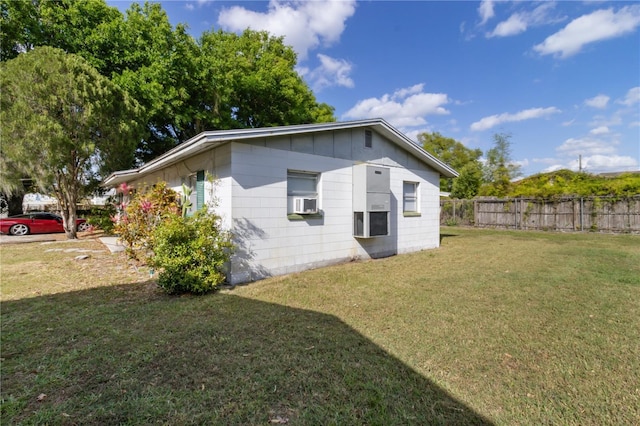 658, 660, 662 24th St NW, Winter Haven, FL 33880 - rear view of property featuring a lawn and fence