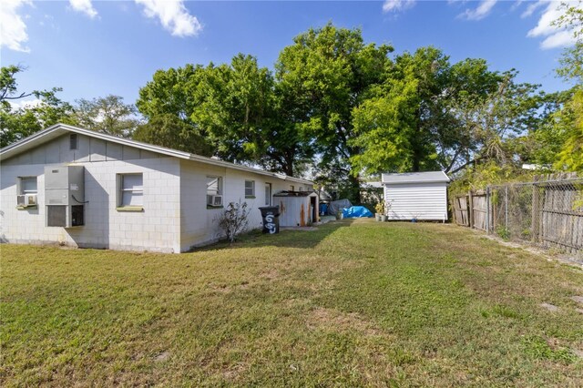658, 660, 662 24th St NW, Winter Haven, FL 33880 - view of yard with an outbuilding, fence, cooling unit, and a storage shed