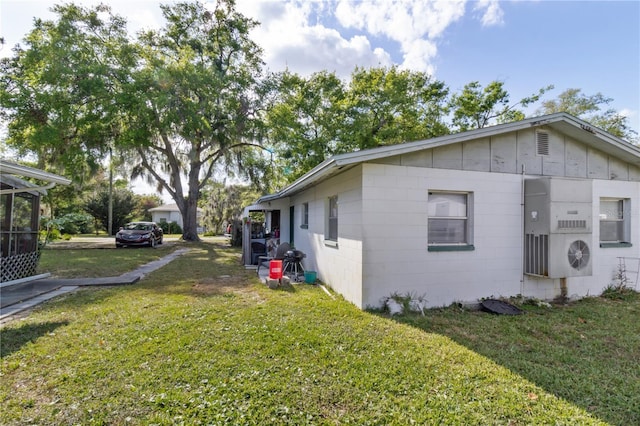 658, 660, 662 24th St NW, Winter Haven, FL 33880 - view of home's exterior featuring concrete block siding and a yard