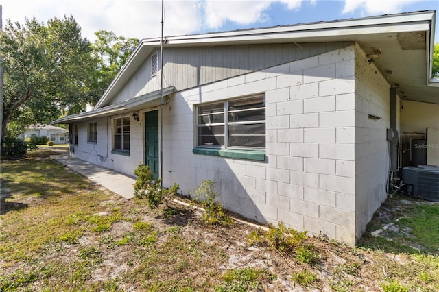 658, 660, 662 24th St NW, Winter Haven, FL 33880 - view of property exterior with central AC unit and concrete block siding