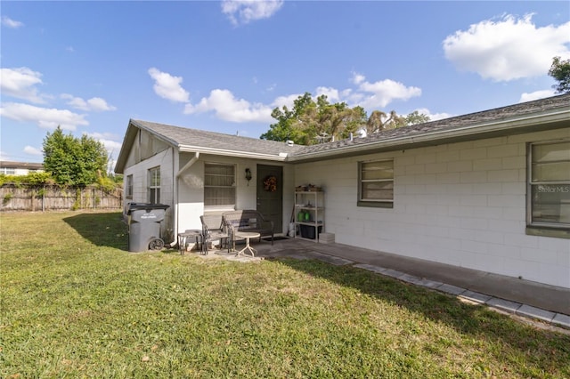 658, 660, 662 24th St NW, Winter Haven, FL 33880 - exterior space with fence, a lawn, a patio, and concrete block siding