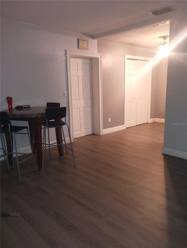 1024 31st St NW, Winter Haven, FL 33881 - dining area featuring dark wood-style floors and baseboards
