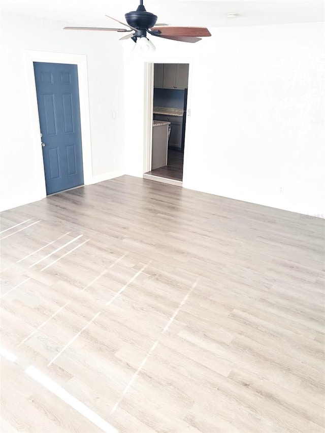 1024 31st St NW, Winter Haven, FL 33881 - unfurnished room with a ceiling fan and wood finished floors
