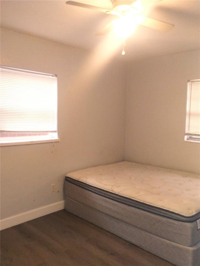 1024 31st St NW, Winter Haven, FL 33881 - bedroom with dark wood finished floors and a ceiling fan