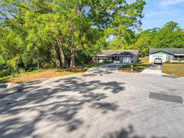 view of road with driveway
