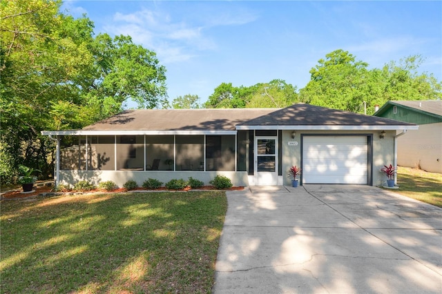 ranch-style home with concrete driveway, a front lawn, an attached garage, stucco siding, and a sunroom