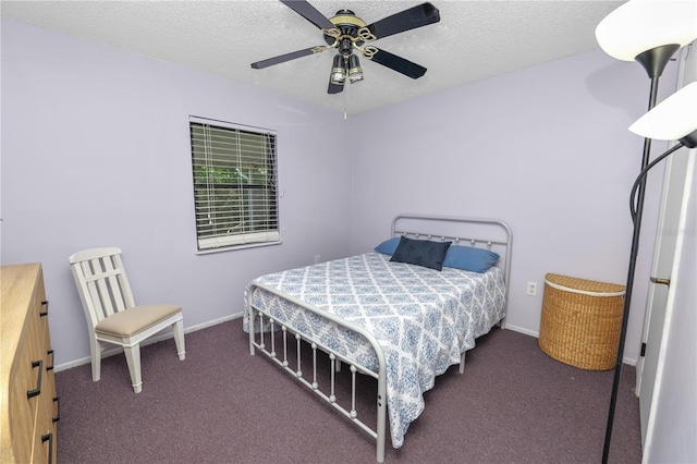 bedroom featuring ceiling fan, baseboards, a textured ceiling, and carpet